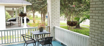 Porch swing, 1920s home, walk to live music