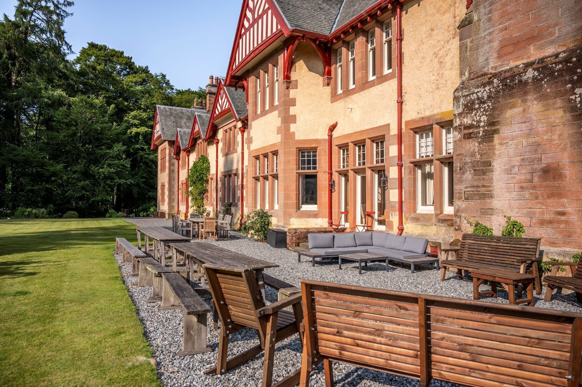A building with a traditional architectural style, featuring a stone facade and red accents.