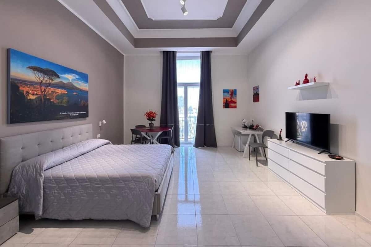 Suite, 1 Queen Bed with Sofa bed, Balcony, City View | In-room safe, desk, laptop workspace, blackout drapes