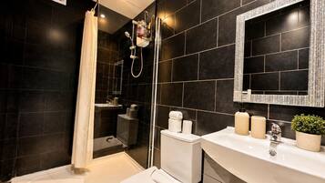 Shower, hair dryer, towels, soap