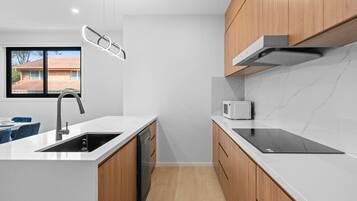 Fridge, dishwasher, cookware/dishes/utensils, dining table