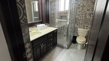 Shower, towels, soap, toilet paper