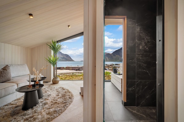 A modern interior with a view of a mountainous landscape.