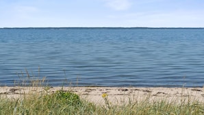A calm body of water with a distant shoreline and overcast sky. - 5 Star Holiday Home in Brenderup Fyn (Middelfart)