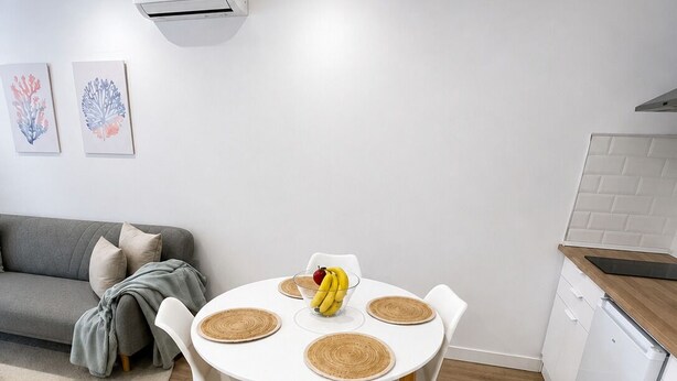 A modern kitchen with white cabinets and a white countertop. - El Paraíso Apartment - Downtown Marbella - Free Parking (Marbella)
