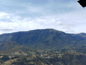A mountainous landscape with a valley below.