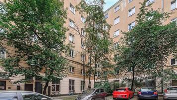 A multi-story residential building with a courtyard.
