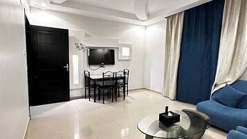 Suite familiar, 2 habitaciones | Área de sala de estar