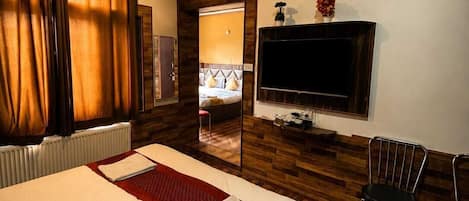 Deluxe Double Room, Mountain View | Desk, blackout curtains, soundproofing, iron/ironing board (on request)
