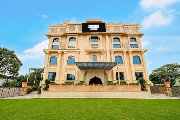A large, ornate building with a sign reading 'PALETTE OYO-Serviced.' - Classic Palette Hotel and Resort (Cuttack)