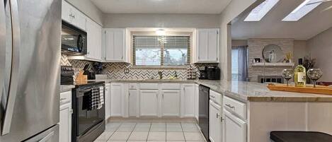 Coffee/tea maker, fridge, microwave, oven