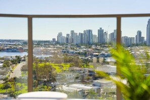 A cityscape with high-rise buildings, a river, and a mix of residential and commercial structures. - The Arches by Aryve | Surfers Paradise (Surfers Paradise)