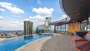 A rooftop pool with a city view, modern architecture, and a curved glass structure. - Modern Style! 1bed/1bath/balcony/pool ~ CBD (Brisbane)