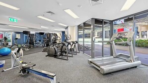 A gym with treadmills, elliptical machines, and weight equipment. - Inner-city Vibes! 2bed/1bath/1car/balcony~cbd (Brisbane)