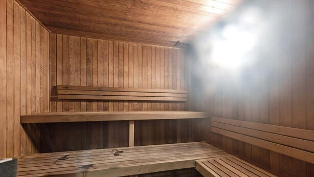 A wooden sauna with benches and a tiled floor. - City Escape! 2bed-2bath-1car-pool-views - CBD (Brisbane)