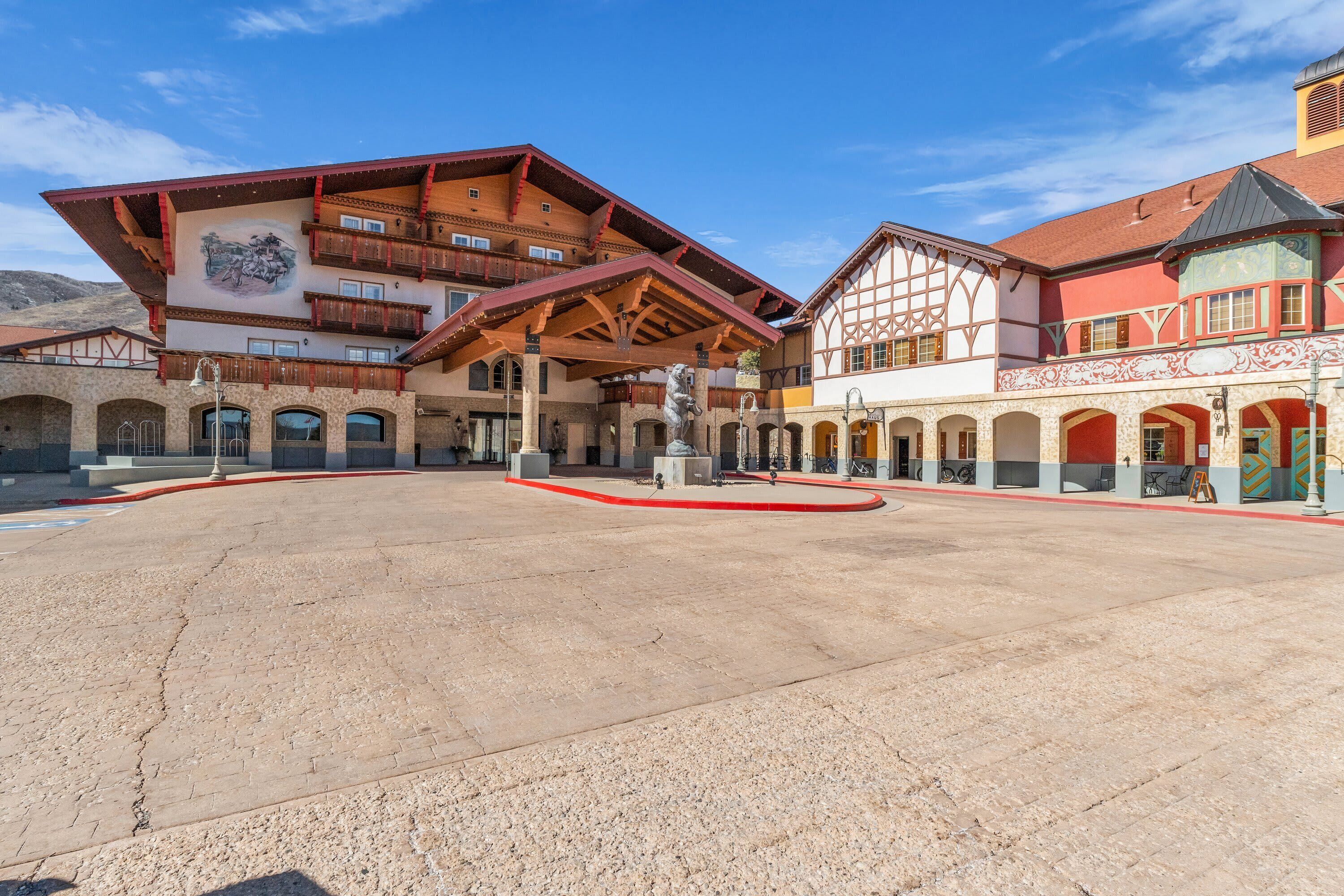 A traditional building with a central courtyard, multiple balconies, and a mix of architectural styles.