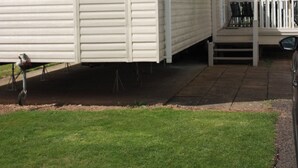 A mobile home with a porch and a wheelchair accessible ramp. - 10 Berth Caravan Butlins Skegness 2 showers pets (Skegness)