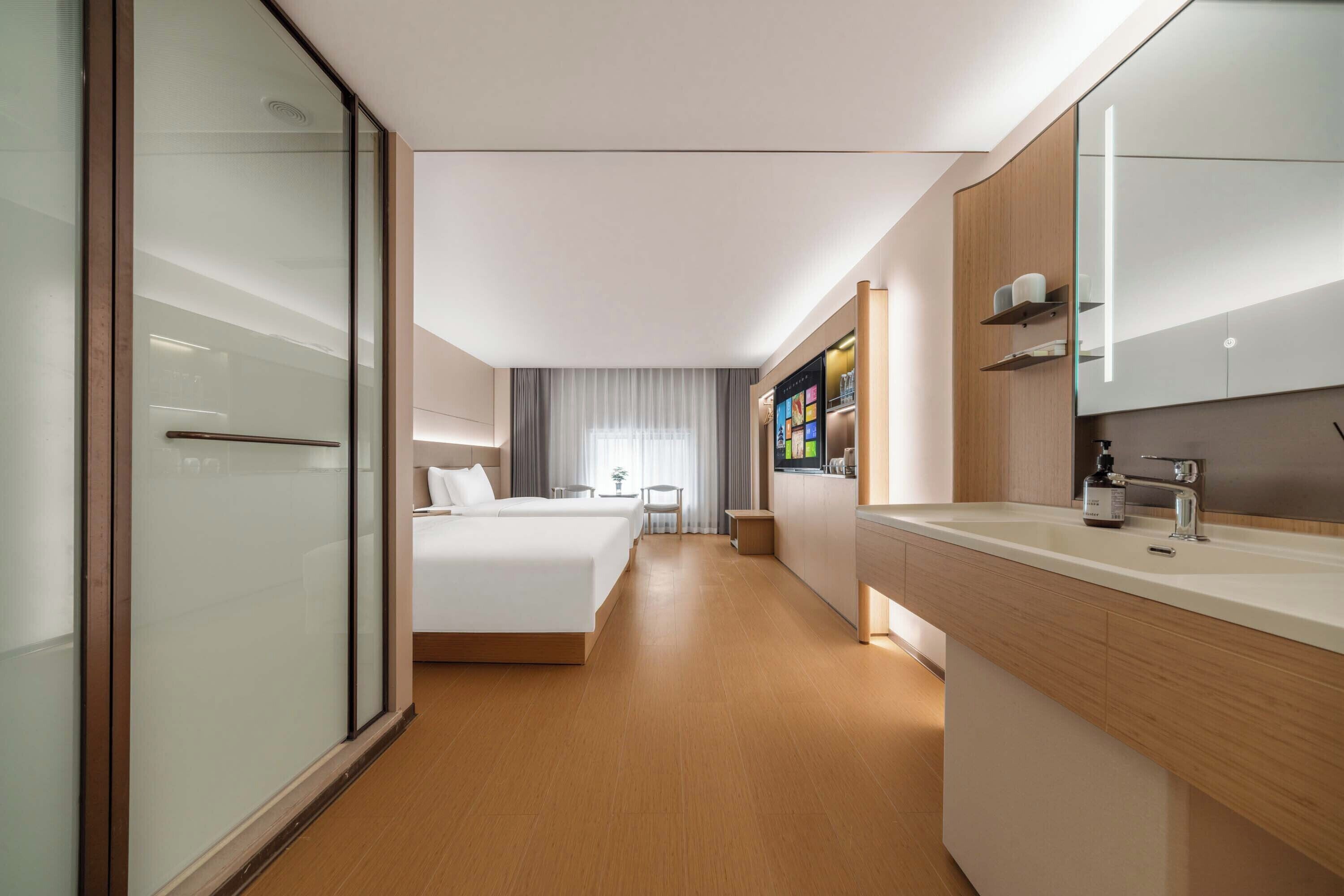 Comfort Twin Room, City View | Minibar, desk, laptop workspace, blackout drapes
