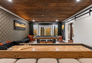 A billiards room with a pool table, a snooker table, and a shuffleboard table. - Bluebird Reserve: Dome • Sauna • Hot-Tub • Cold Plunge • Fire-Pit • Putt • Views (Mineral Bluff)
