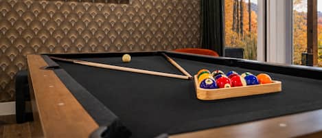 Catch a game of pool for a little competitive edge on your mountain getaway.