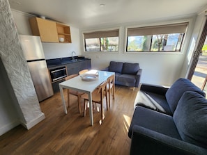 Family Cabin | Living area - Tasman Holiday Parks Mount Beauty (Tawonga South)
