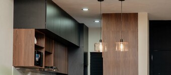 Modern house with a private garden and double-height ceiling in Comala