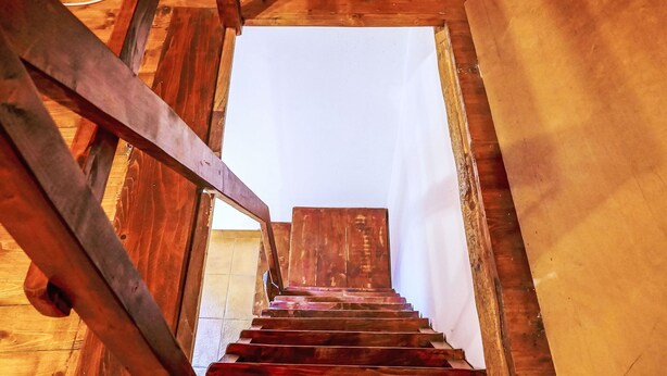 A wooden staircase leading to a white ceiling. - Rustico Grace by Interhome (Malvaglia)