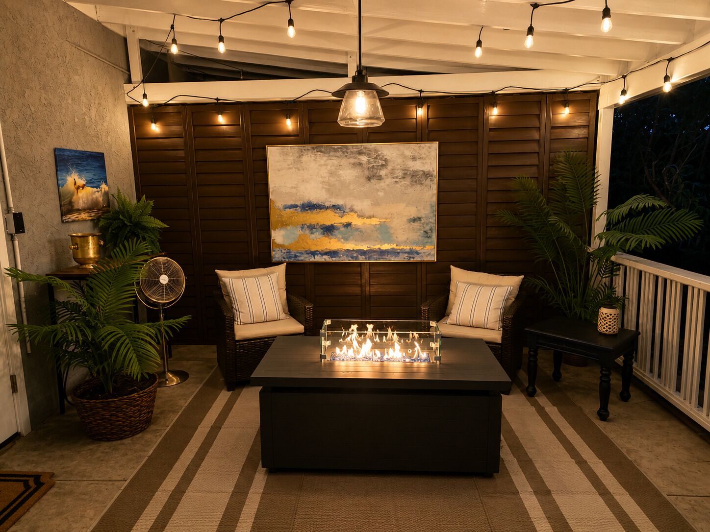 A cozy indoor seating area with a table, chairs, and a fan.