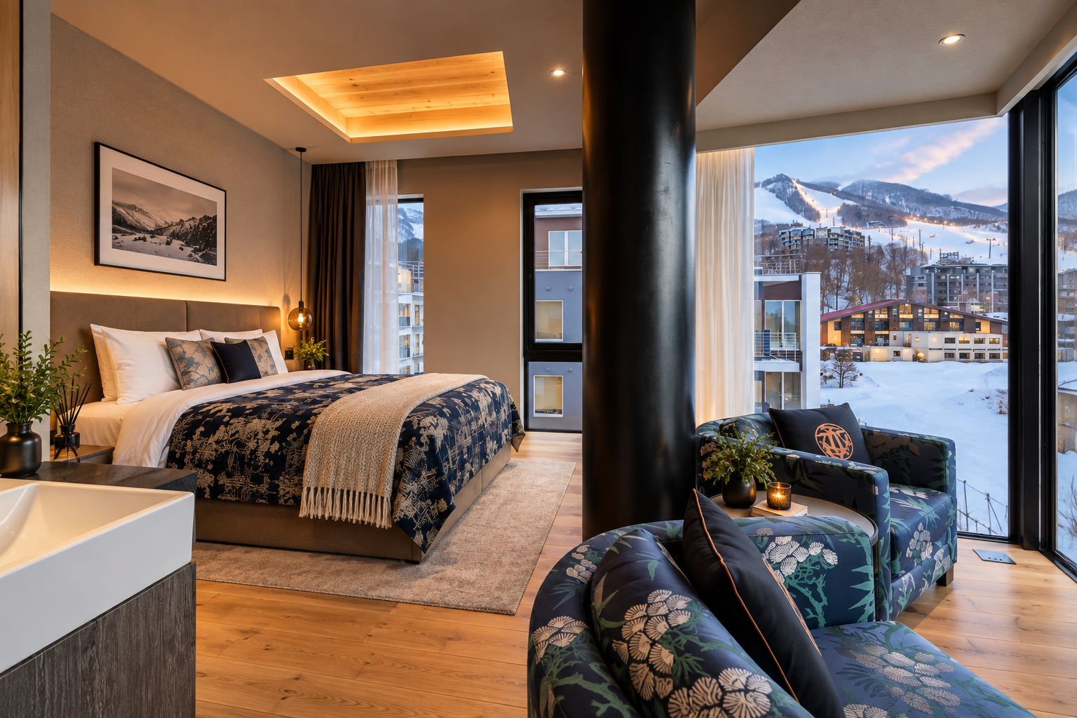 A modern hotel room with a large bed, a sitting area, and a view of a snowy landscape.