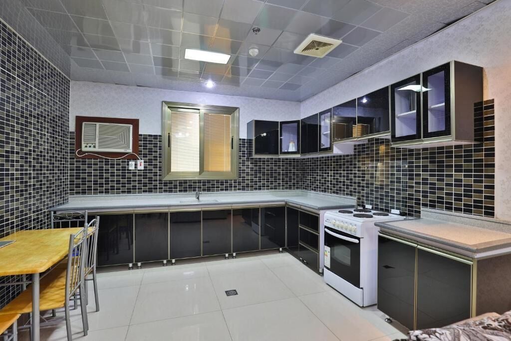 Deluxe Apartment, City View | Private kitchen | Fridge, oven