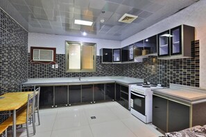Departamento Deluxe, vista a la ciudad | Cocina privada