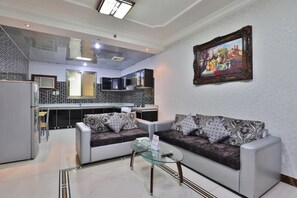 Deluxe Apartment, City View | Living area | Printers - Jubail High Rise Serviced Apartment  (Al Jubayl)