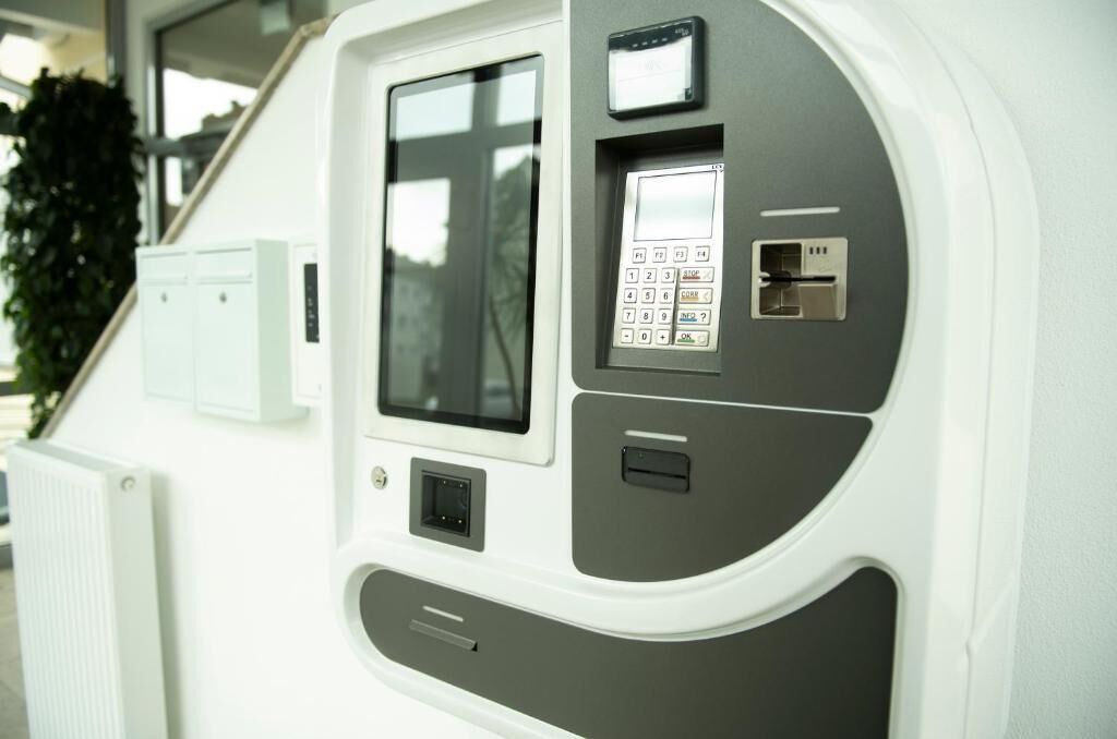 A control panel with a keypad, a display screen, and a USB port.