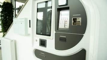 A control panel with a keypad, a display screen, and a USB port.