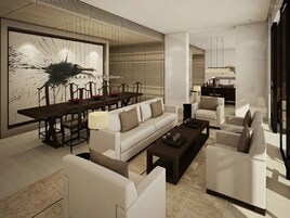 Una sala de estar moderna con un conjunto de sofá, una mesa de centro y un comedor con mesa y sillas.