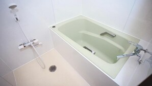 A bathroom with a bathtub, a shower, and a toilet. - SHINKA HOTEL (Sapporo)