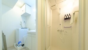 A bathroom with a shower, a sink, and a cabinet. - Choujamaru bill (Shinagawa-ku,Kamiosaki)