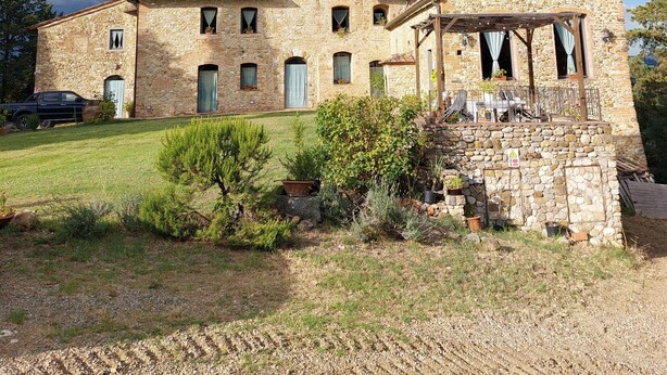 A stone building with a central tower, multiple windows, and a covered porch area. - Rosmarinus Apartment – Two-Room Flat with Views of Tuscan Vineyards (San Casciano In Val di Pesa)