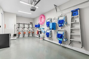 A clean, well-lit room with exercise bikes, a large pink exercise ball, and various medical equipment. - Welcome Home to 30A – FREE Golf Cart (Santa Rosa Beach)