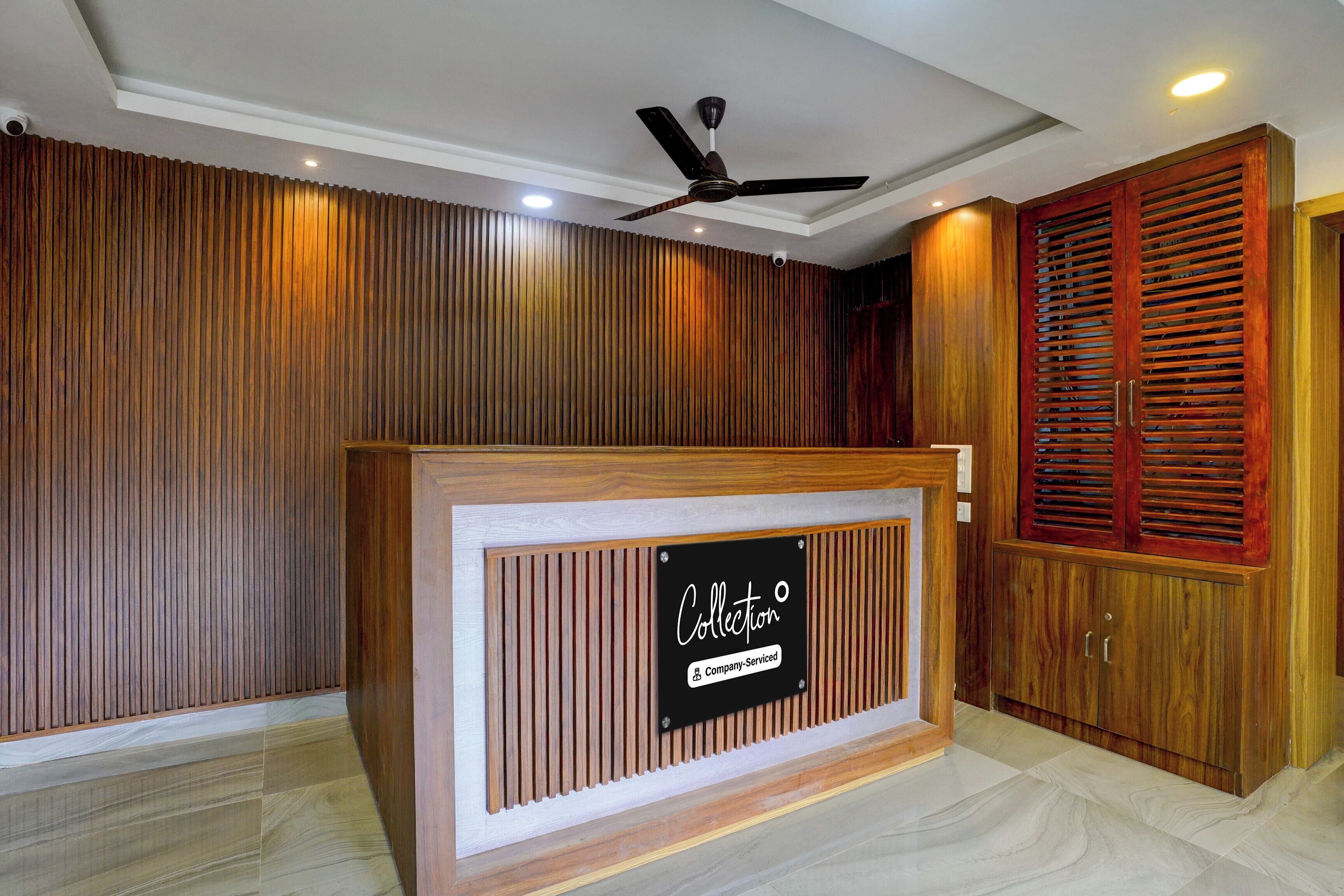 A reception desk with a sign that reads 'Collection Company-Serviced.'