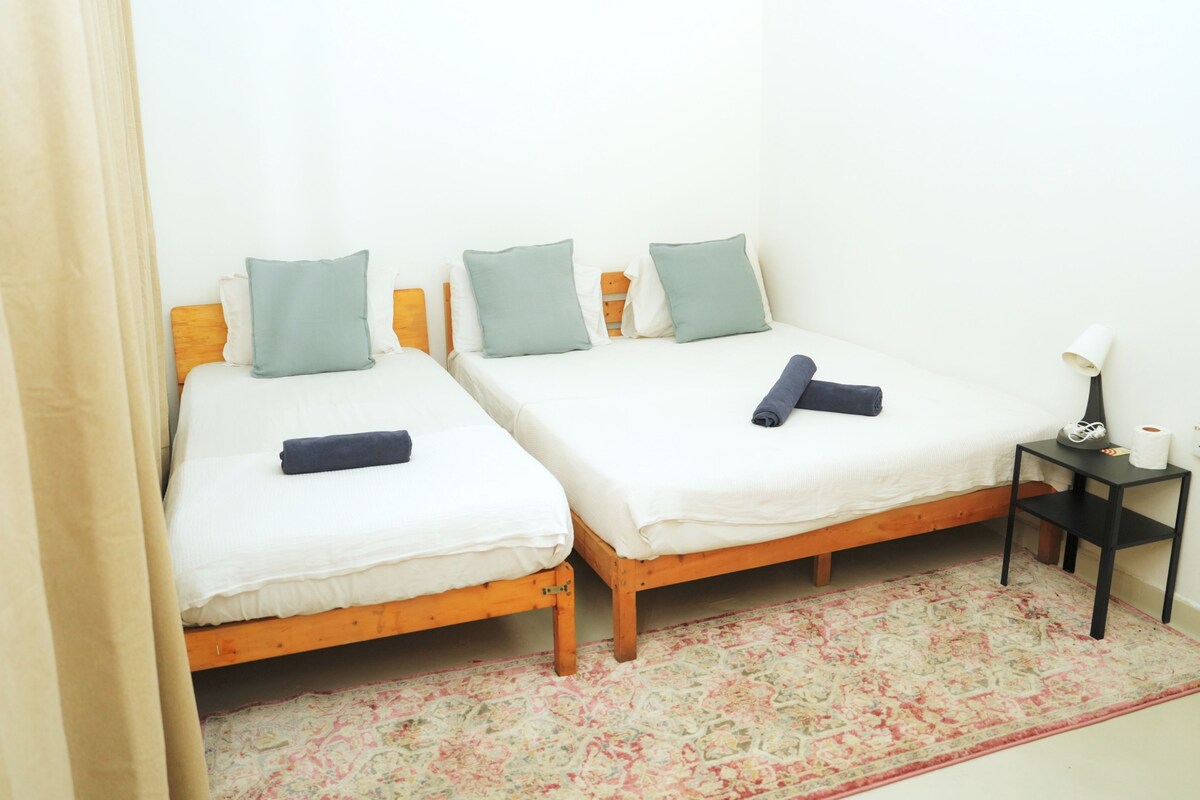 Deluxe Triple Room, City View | Desk, laptop workspace, WiFi (free), bed sheets