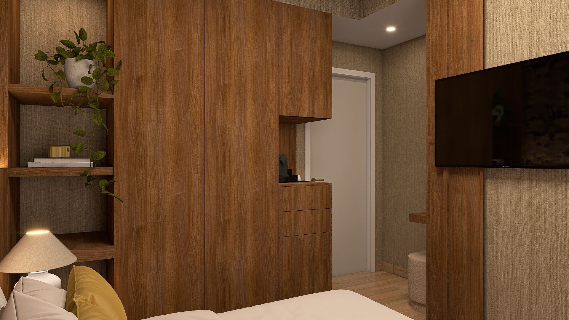 A bedroom with a bed, a bedside lamp, a TV mounted on the wall, and a wooden wardrobe with a mirror.