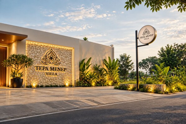 A modern villa with a stone facade and a sign reading 'TEPA MENEP VILLA'. - Tepa Menep Villa (Ngaglik)