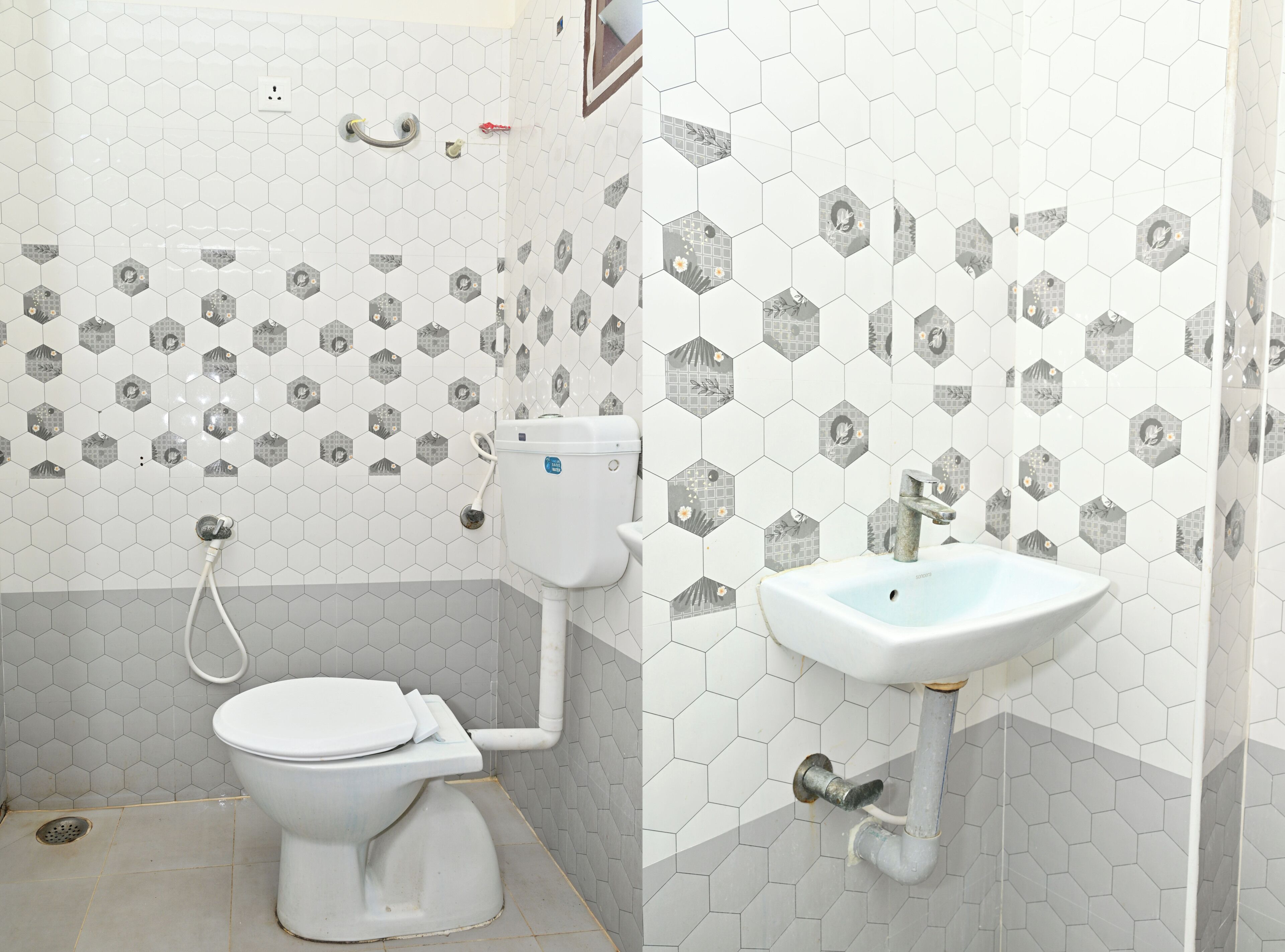 A bathroom with a toilet, sink, and shower.