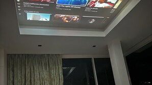 A modern bedroom with a skylight, a large window, and a bed. - Kamala Jungle Suite 80m² Balcony, 2 Pools, Gym & Sauna Fast Fiber WiFi (Kamala, Kathu)