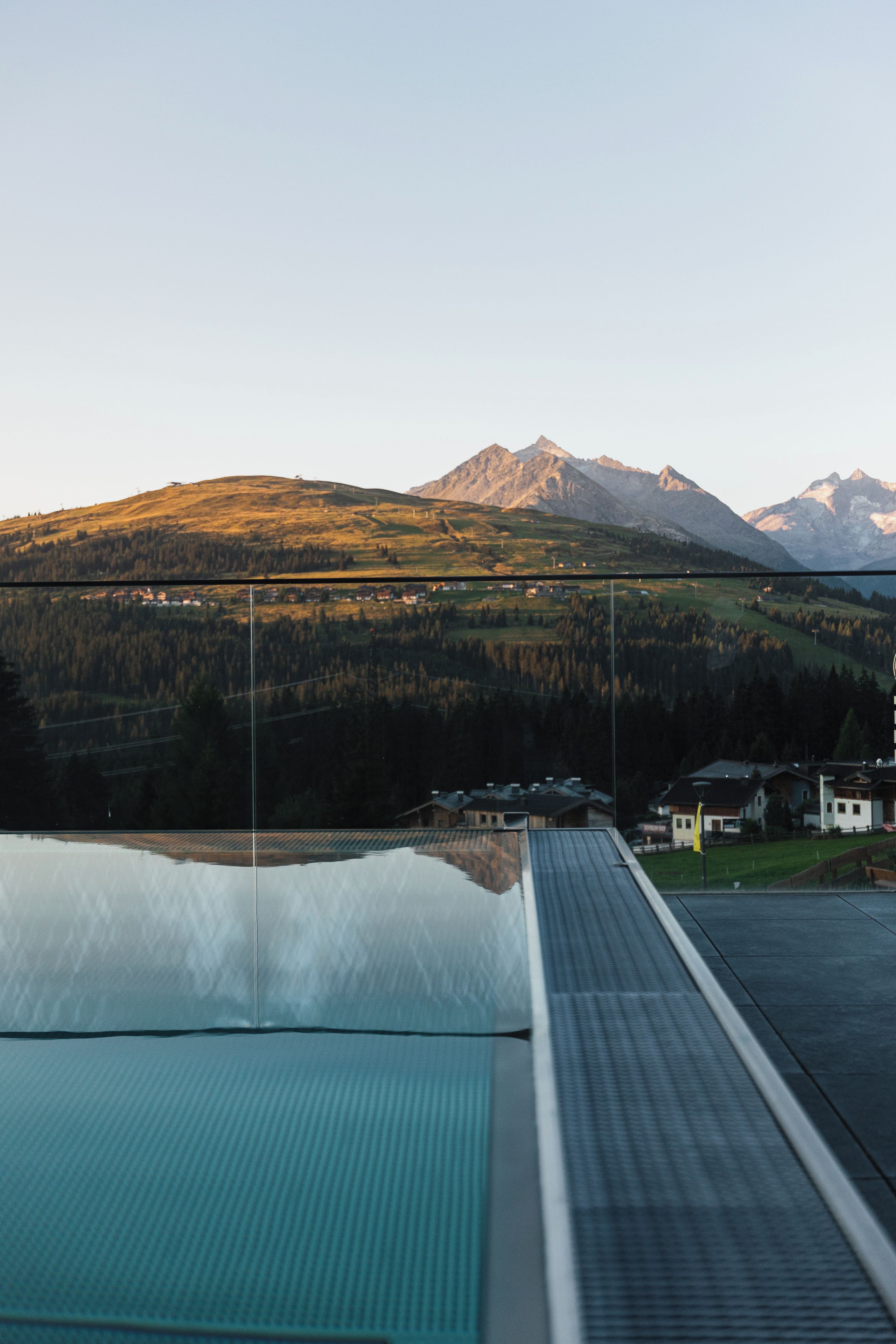 A panoramic view of a mountainous landscape with a clear sky.
