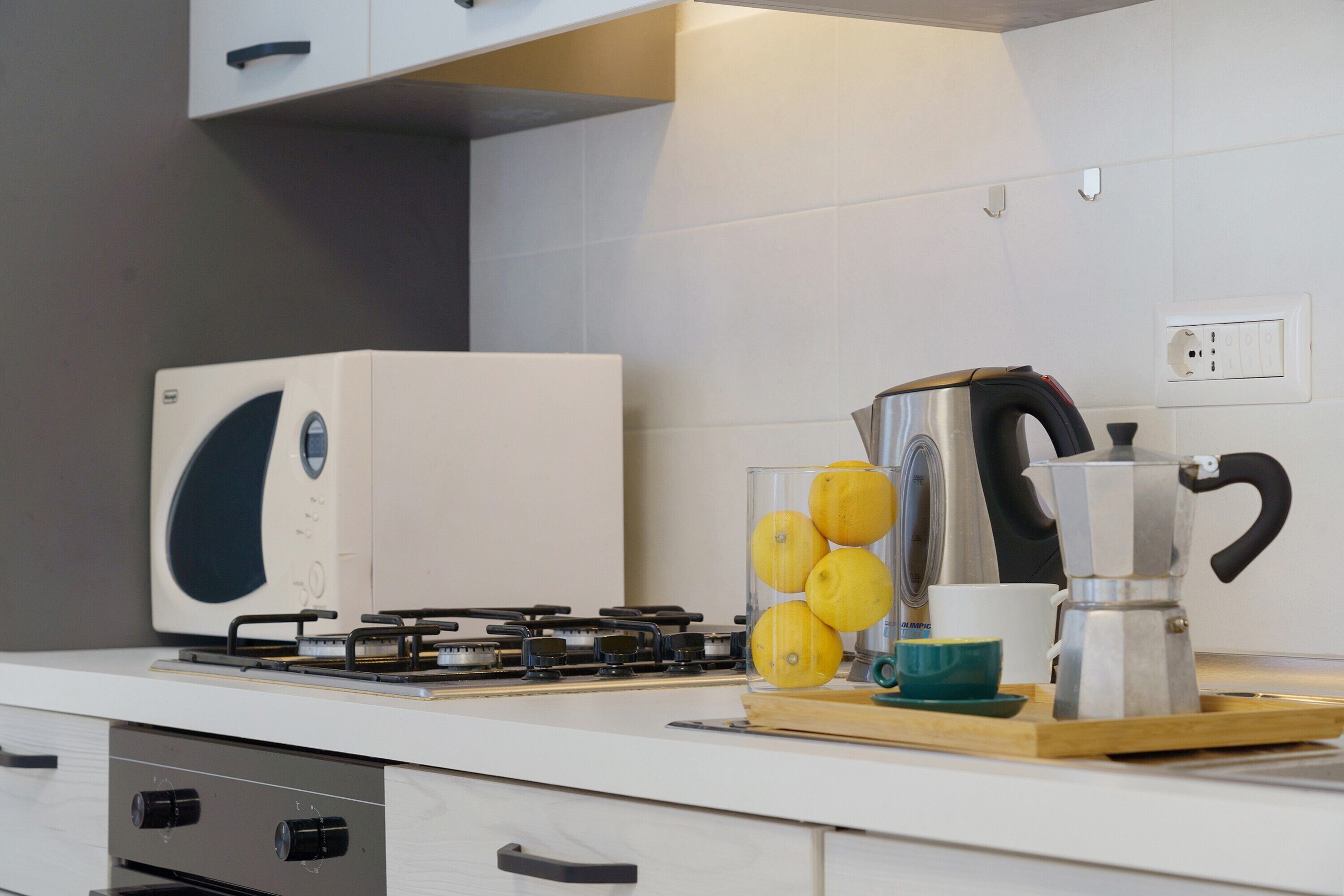 Coffee/tea maker, fridge, microwave, oven