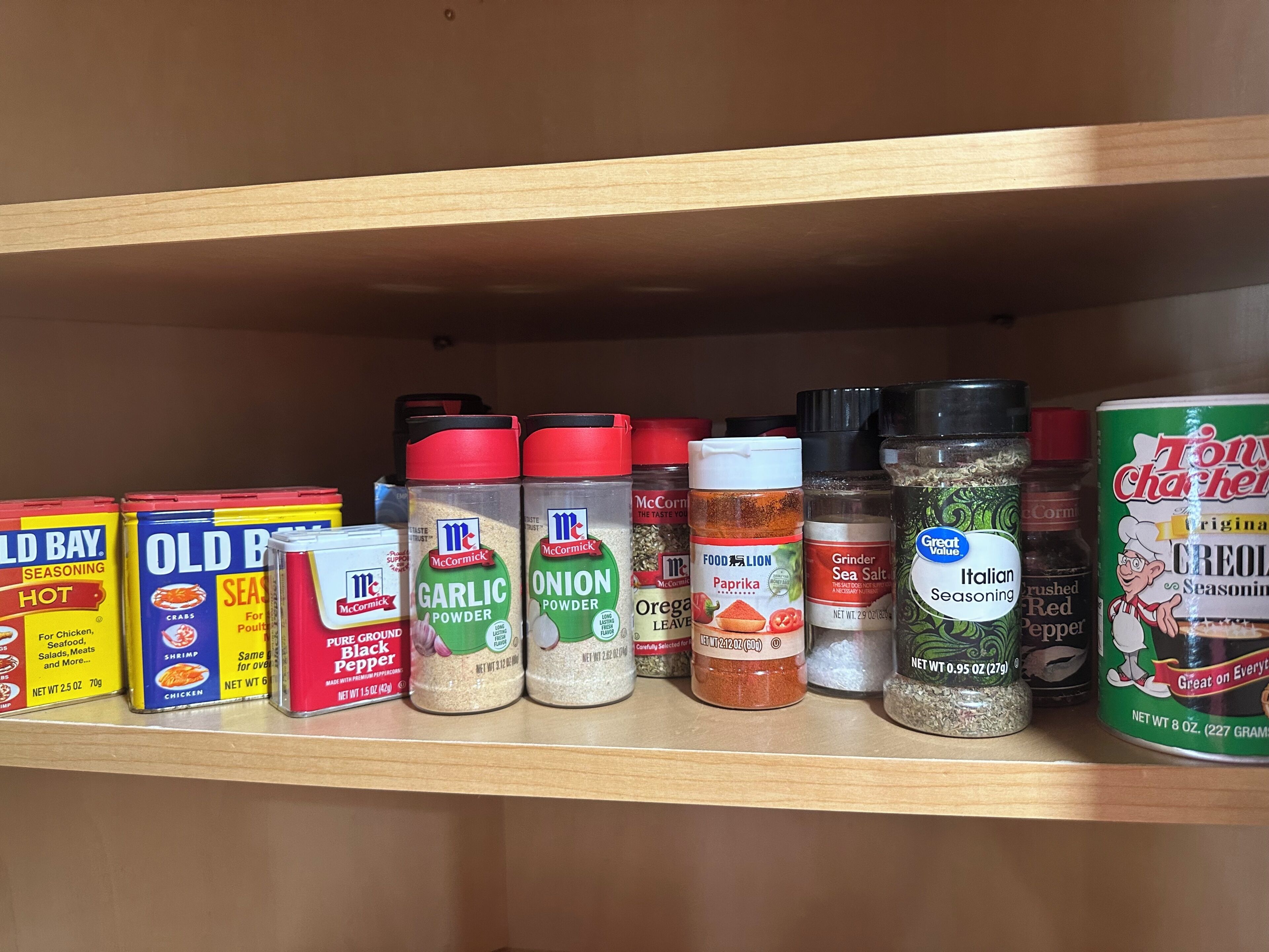A shelf stocked with various McCormick seasoning products.