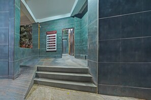 A staircase leading to a door with a sign indicating the Vishwagaru Complex. - Super Collection O Baner Hillview Pune (Pune)