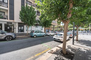 A street view with parked cars, a building with a sign reading 'Edif. EDIMAR IX Portal 3', and a tree in the foreground. - Apartment 'Edimar' with Balcony and Air Conditioning (Benidorm)